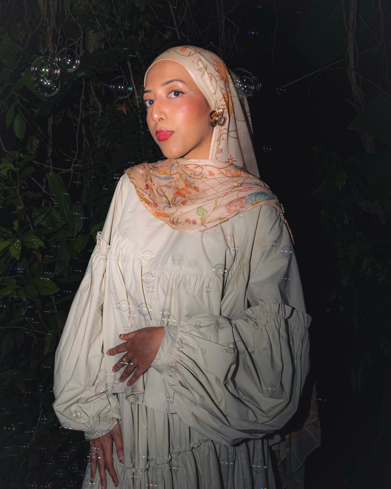 Model wearing Soof Fotosynthesia printed modal cotton scarf hijab scarf in offwhite.